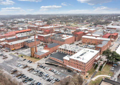 Aerial drone view looking at historic red brick buildings in the Historic River District in Danville, Virgina