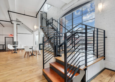 Modern black metal stair railings interior apartment building foyer