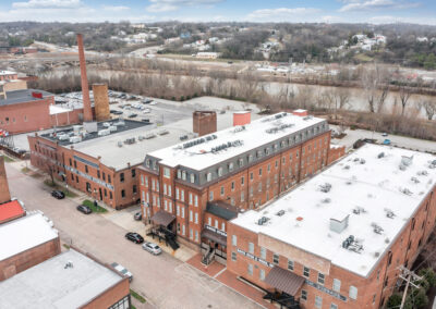 Rooftop view of four historic red brick warehouse buildings